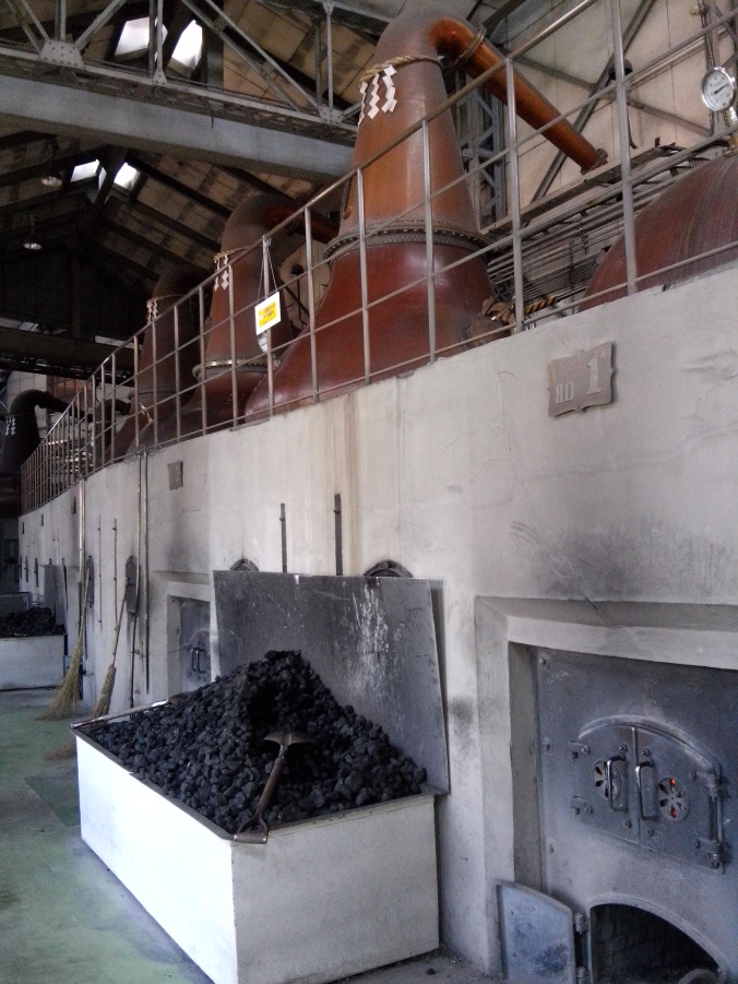 Giant stills which are heated by direct coal fire